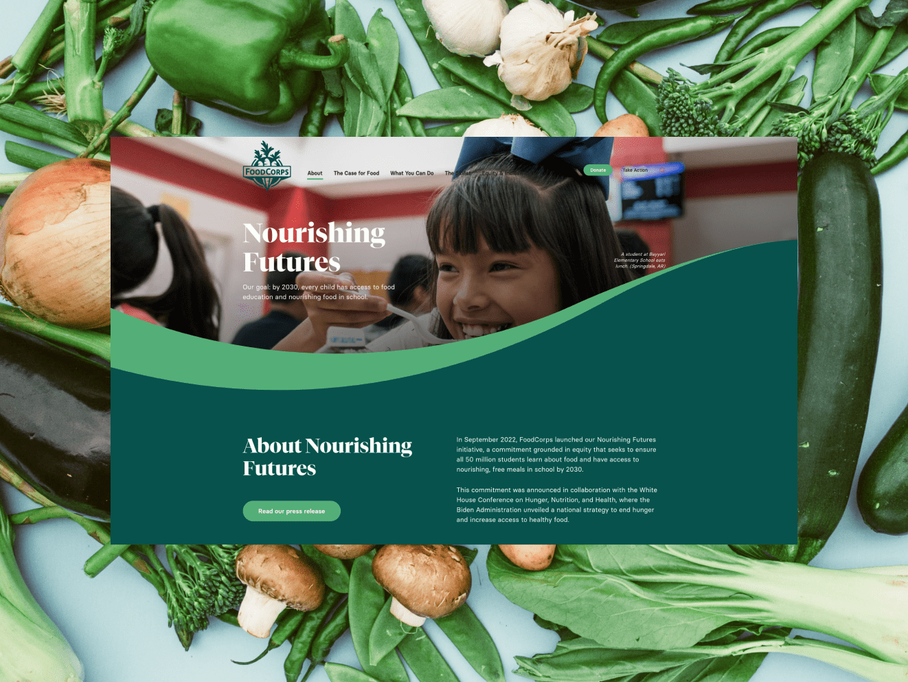 The Foodcorp website homepage with the words &quot;Nourishing Futures&quot; and an array of aesthetically arranged vegetables in the background.